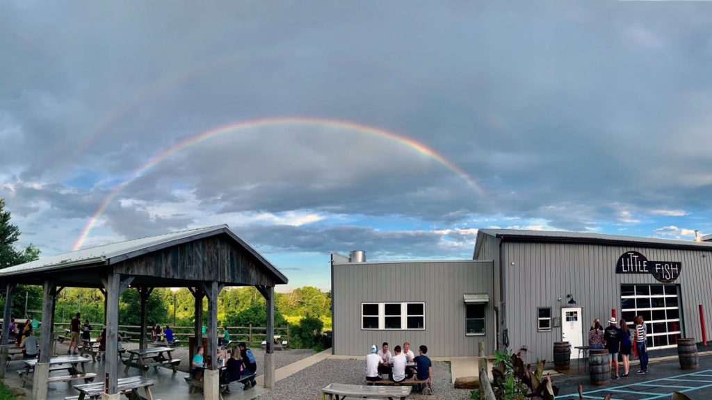 Little Fish Brewing's Athens, Ohio location with a double rainbow overhead.